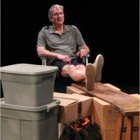 Photo of a man sitting in a chair with his feet up