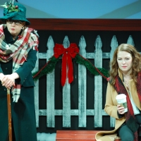 A woman sitting on a bench and a woman wearing a hat standing next to her