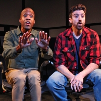 Two men looking forward, with looks of mild alarm on their faces.