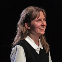 Young girl in a catholic school uniform smiling