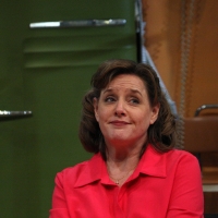 Woman in a pink dress looking off screen