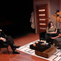 A man and two women sitting in a mid-century living room