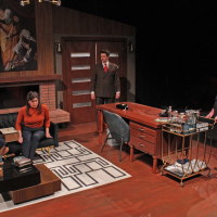 A group of four people sitting in a mid-century living room