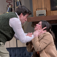 A man leaning over a woman holding her face in his hands, both look frantic