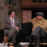 Two men sitting on a couch talking