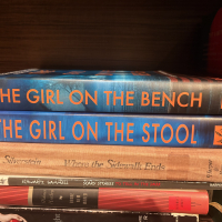 Books stacked on a bookshelf