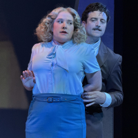 A man holding a woman from behind, she looks frightened