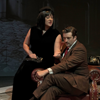 A woman showing her little finger to a man in a suggestive way