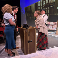 A man and a woman standing at a counter talking to another man and woman on the other side of it