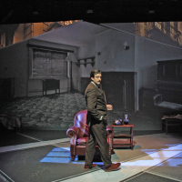 A man standing in front of a projection of an apartment