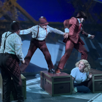 A group of people struggling on top of a train