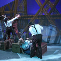 Four people struggling atop a "train"
