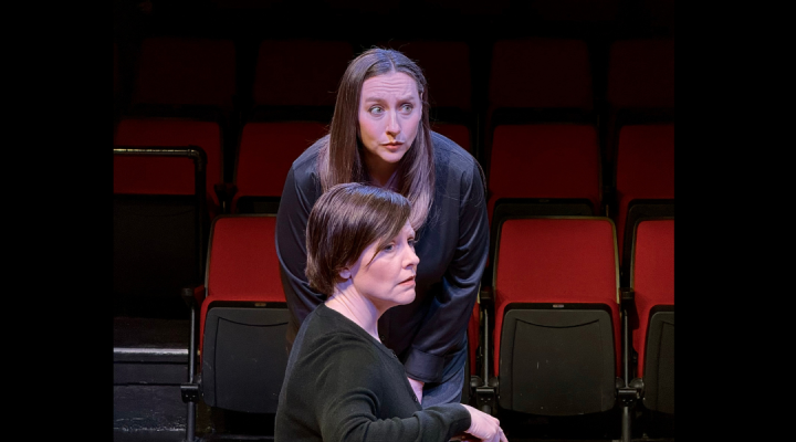 Two women looking at something off camera